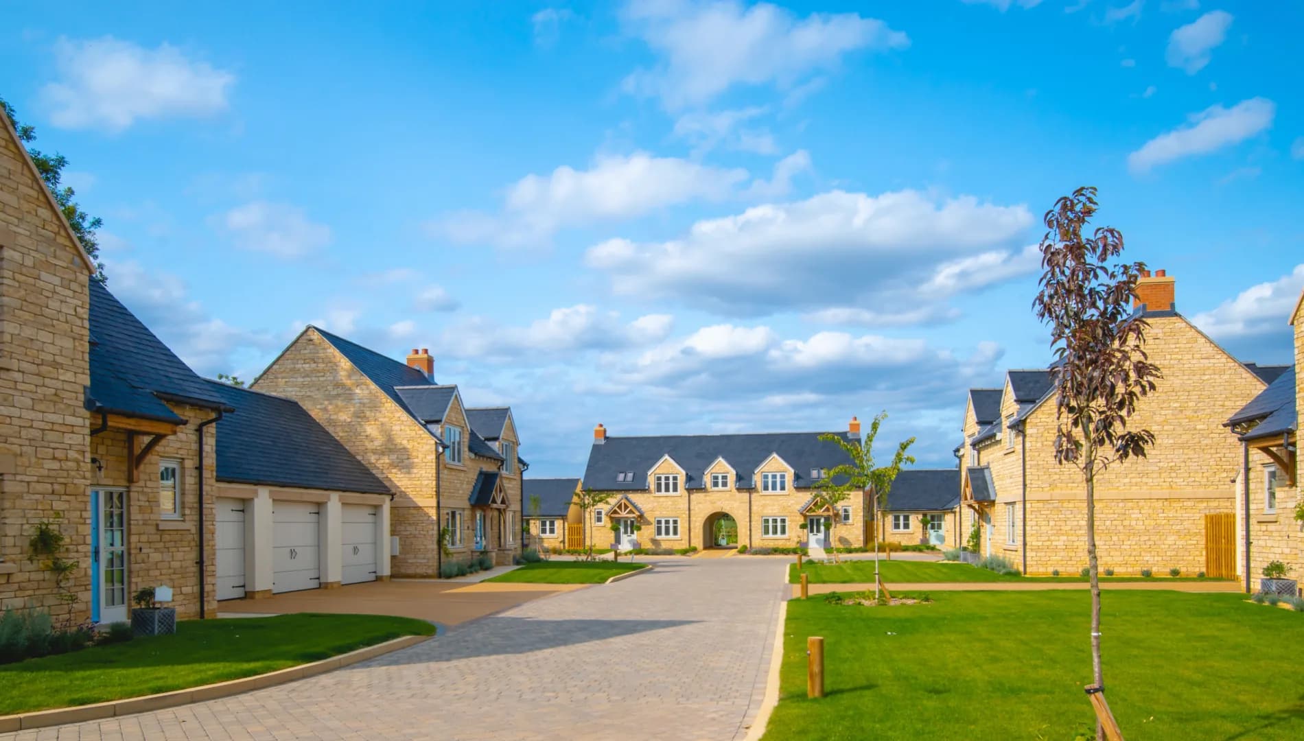Completed block-paved access road and driveway on a residential development — Evenii hard landscaping